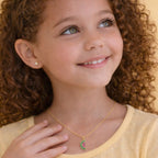 Children's Venetian necklace with a watermelon pendant studded with red and green cubic zirconia, 18k gold plated, and for hygienic purposes.