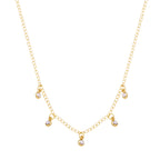 Children's necklace with five dangling pearls, plated in hypoallergenic 18k gold.