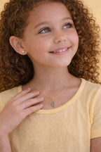 Delicate 2mm ball stud earrings for children, 18k gold plated, hypoallergenic.
