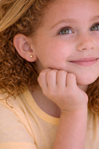 Delicate 2mm ball stud earrings for children, 18k gold plated, hypoallergenic.