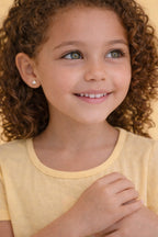 Delicate children's pearl earring with hypoallergenic 18k gold-plated post.